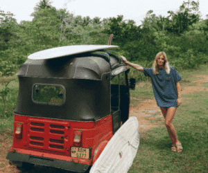 tuktuk girl with surfboard