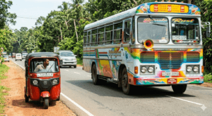 A private bus passing a tuk tuk on a Sri Lankan road illustrating the "Bus Rule" safety priority.